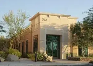 Dental clinic building — beige facade, large glass doors, address “362” visible