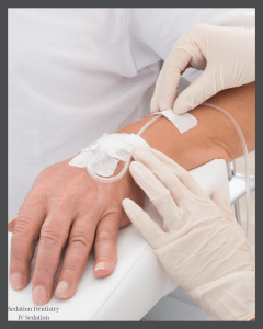 Gloved hands placing IV catheter in patient’s arm — “Solstice Dentistry” watermark